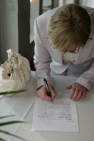 sheilasignsthemarriagecertificate.jpg