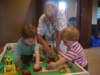 evanliamandgrandpaplaywiththetrainset_small.jpg