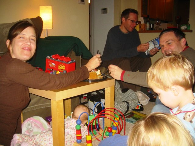 susanandpaddyeatcakewhilejosiehidesunderthetable.jpg